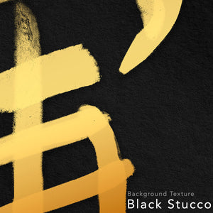 Close up on a design of a japanese kanji with gold ink on a black stucco background.