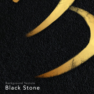 Close up on a design of a kanji symbol. Gold ink on black stone background.